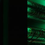 a rack of electronic equipment in a dark room